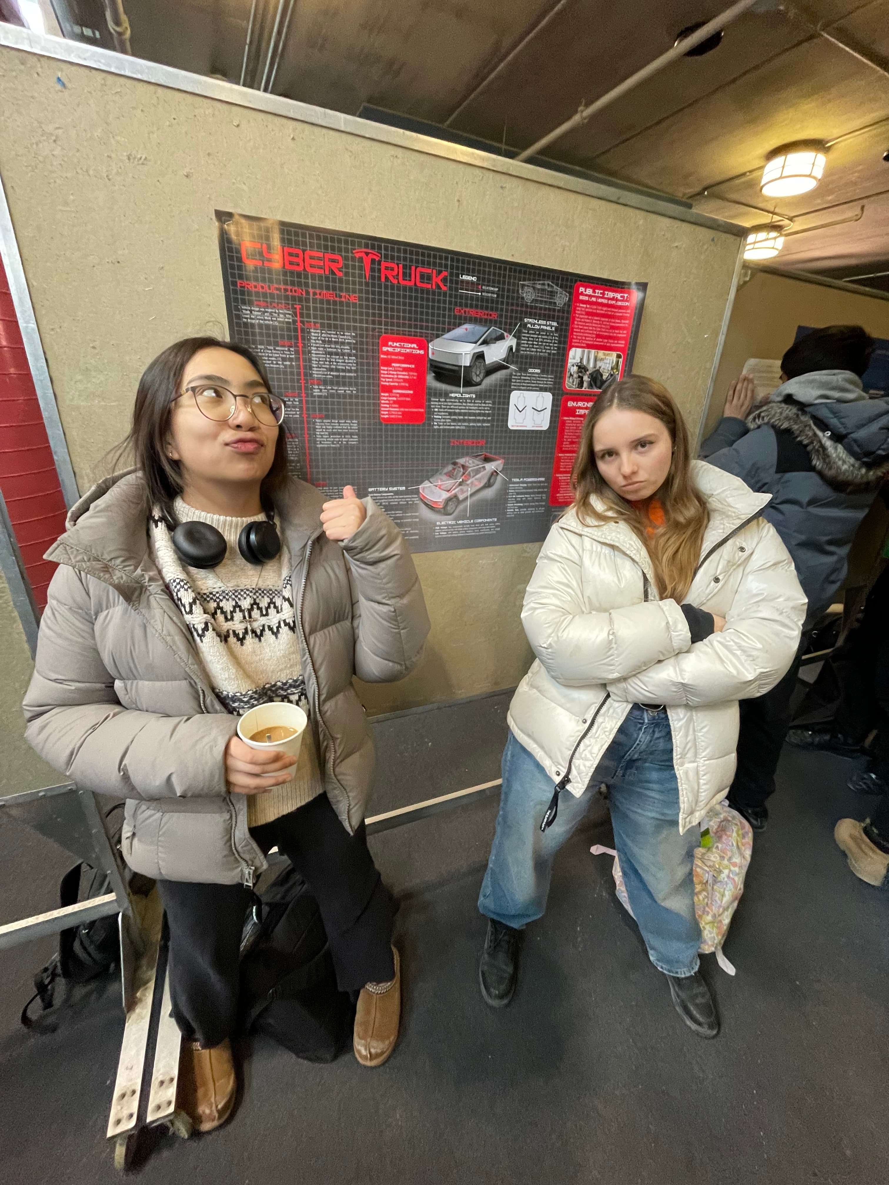 Students with Cyber Truck poster
