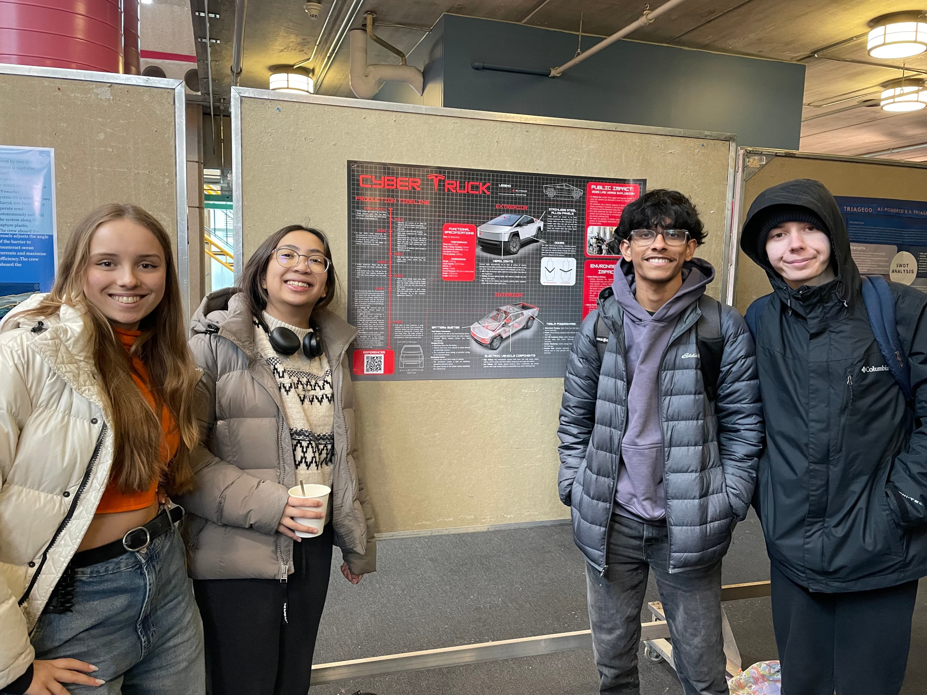 Students with Cyber Truck poster