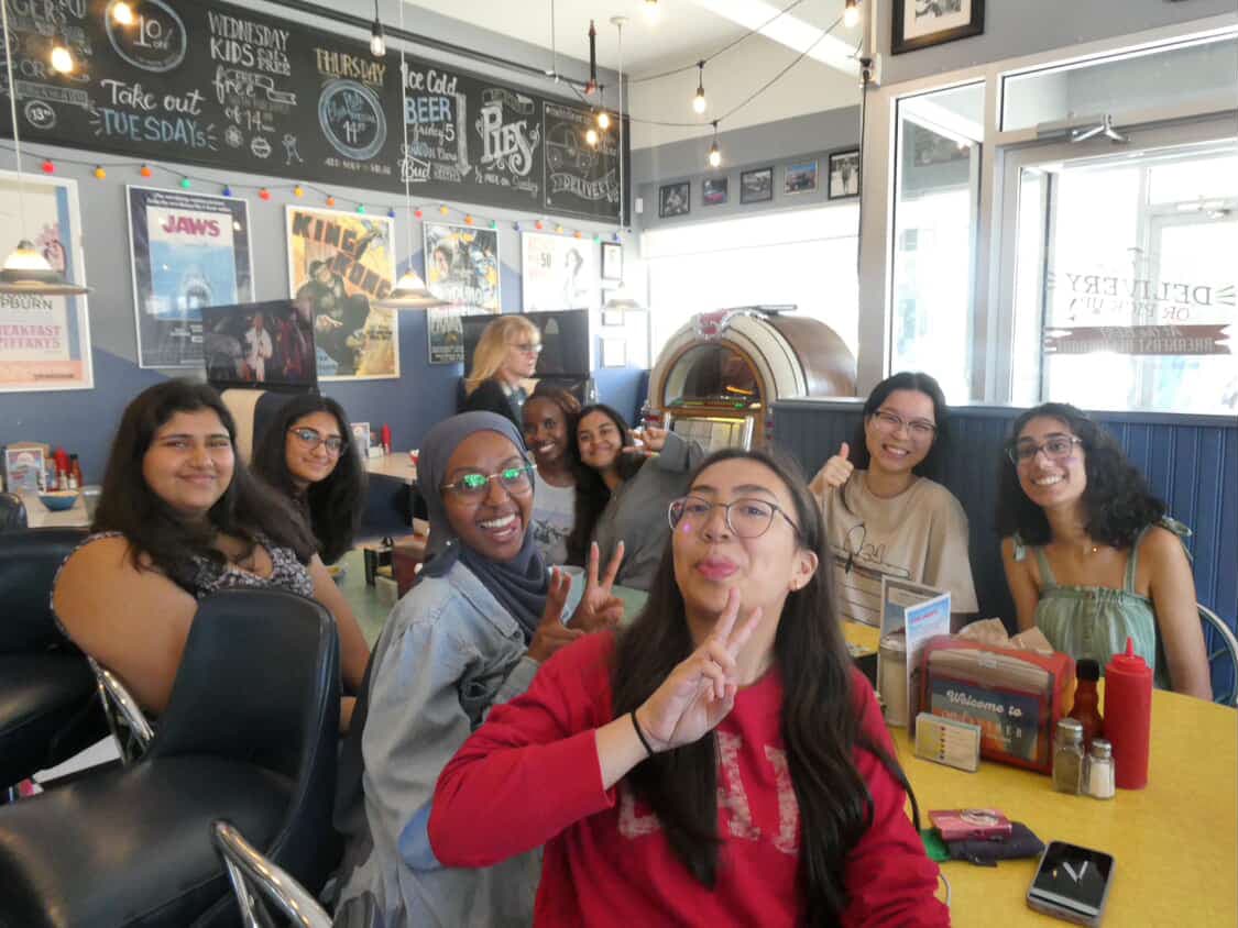 Group selfie at diner